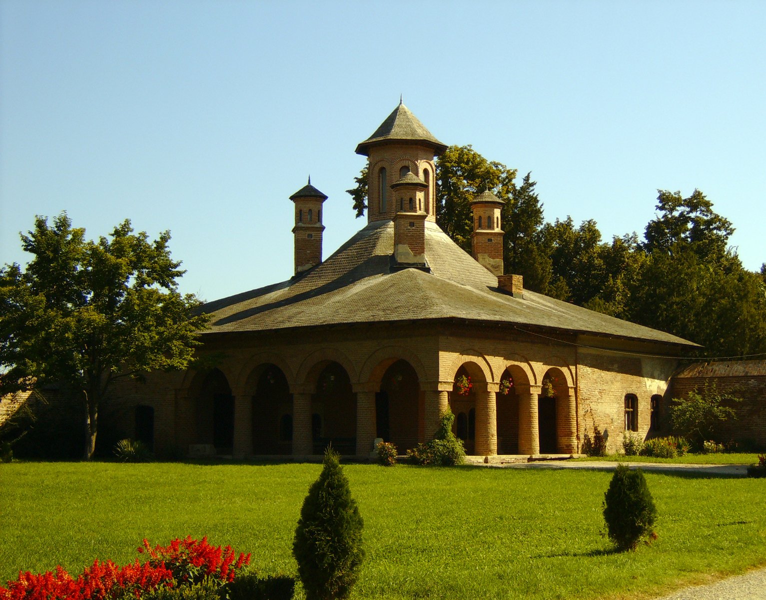 the front view of a large building in a park