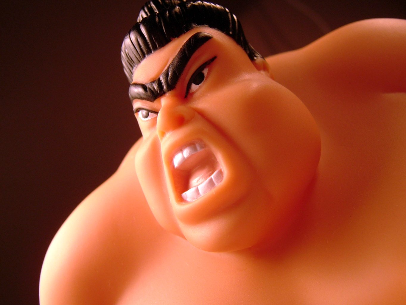 a close up of a toy of a man's face and chest