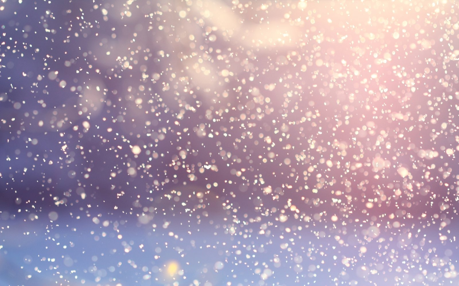 a picture of snow falling and the snow in mid - day