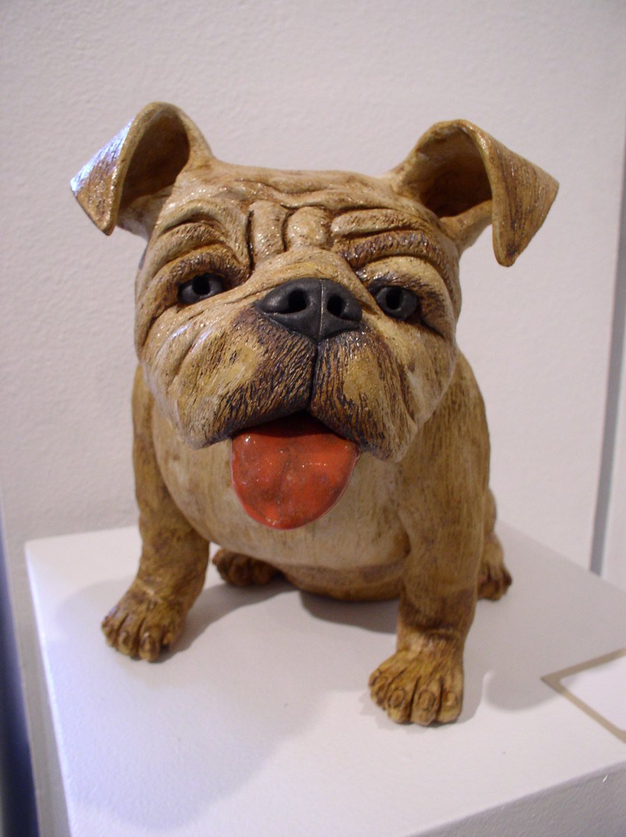 a ceramic dog has its tongue out
