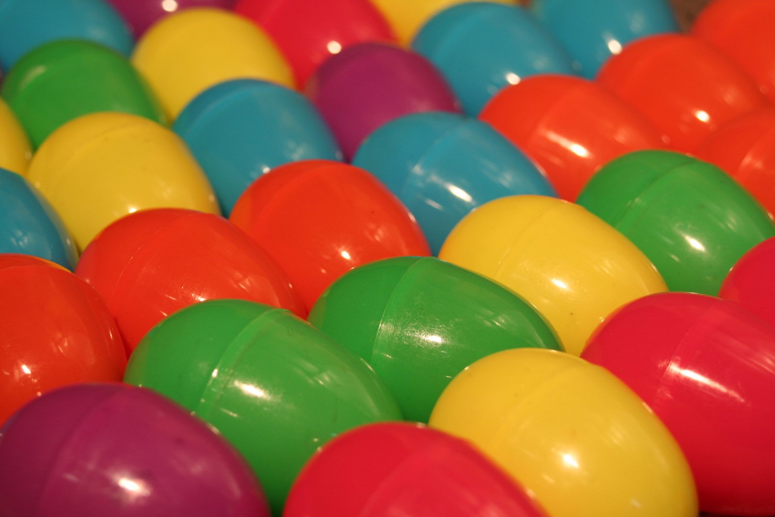 the rainbow colored balls have been made of plastic