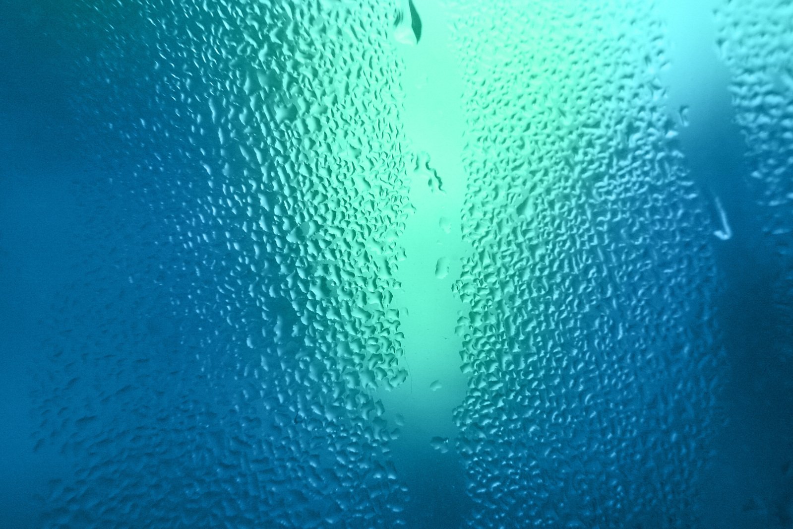 a blue water pattern made up of small drops