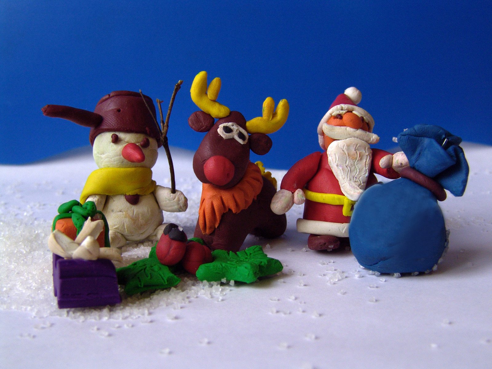 a group of toy figurines that are on some snow