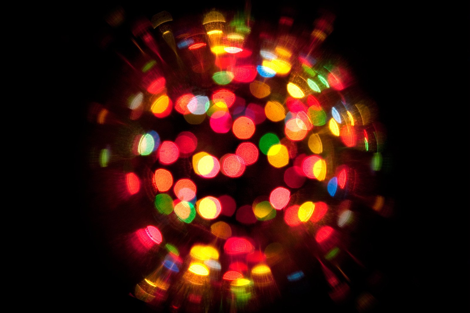 a colorful circle made with brightly colored lights