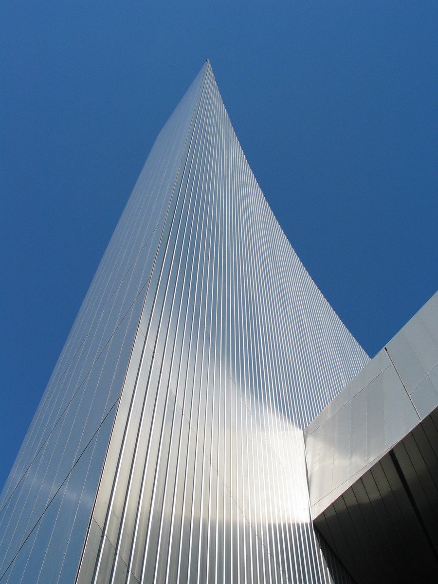 a very tall building with a sky in the background