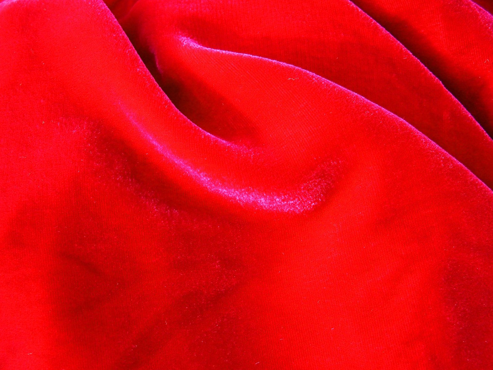 a closeup of a red velvet fabric