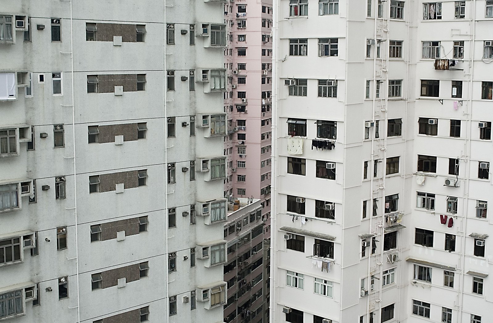 some very tall white building with open windows