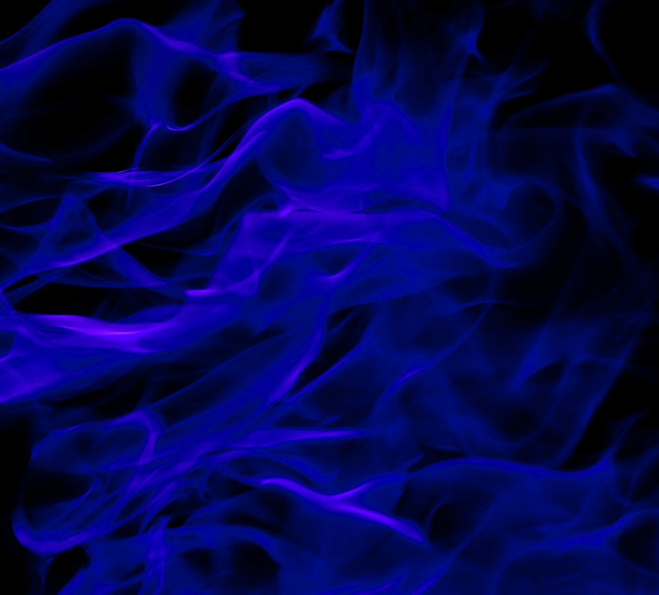 fire flowing into the air and making blue smoke