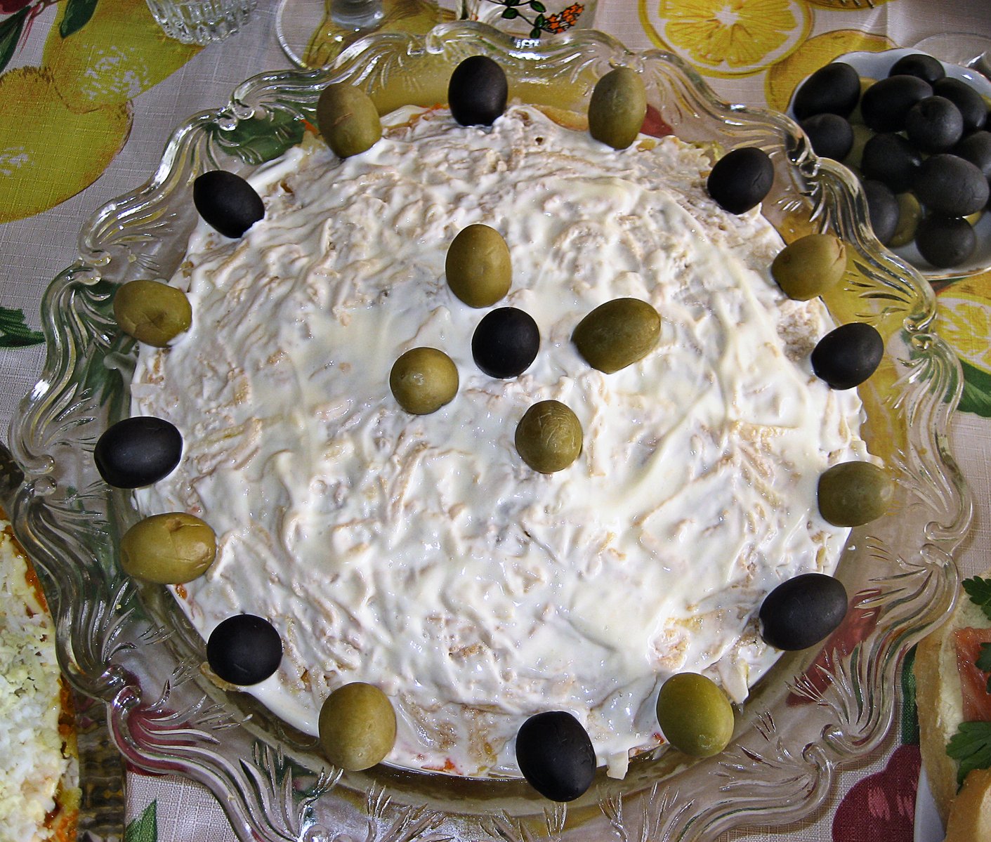 an image of olives arranged around a cake