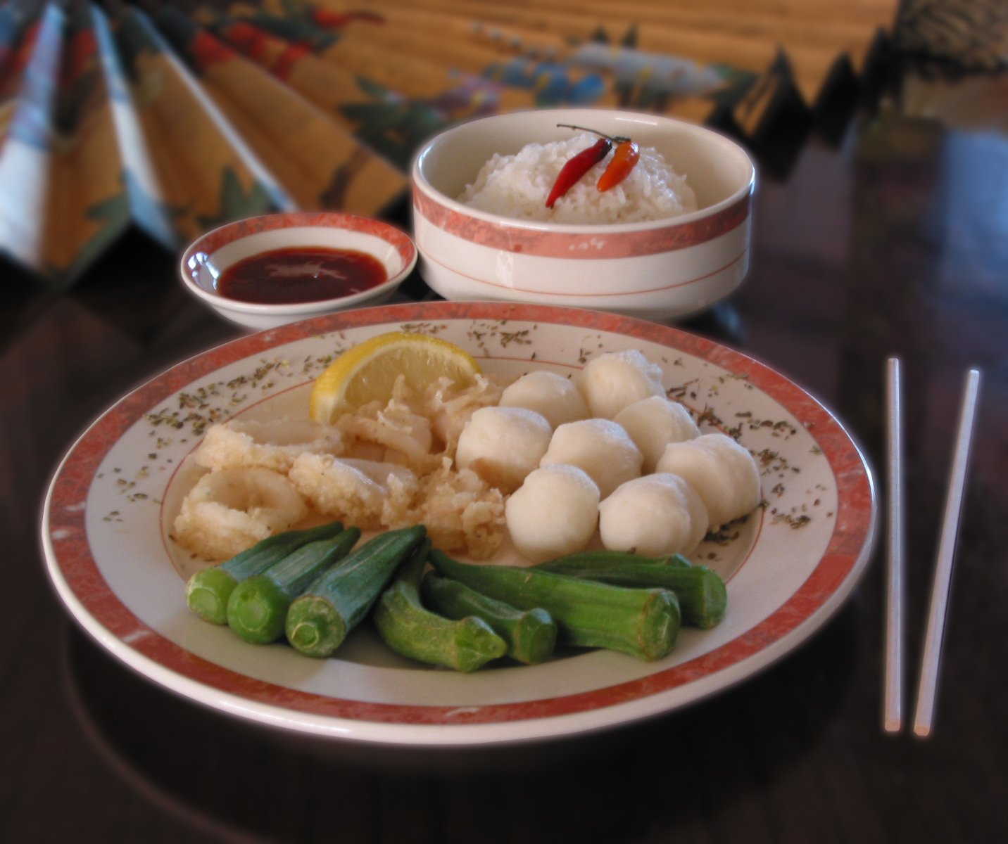 an oriental meal with scallops, asparagus, and rice