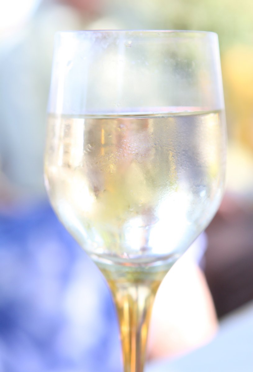 a glass of water is sitting on the table