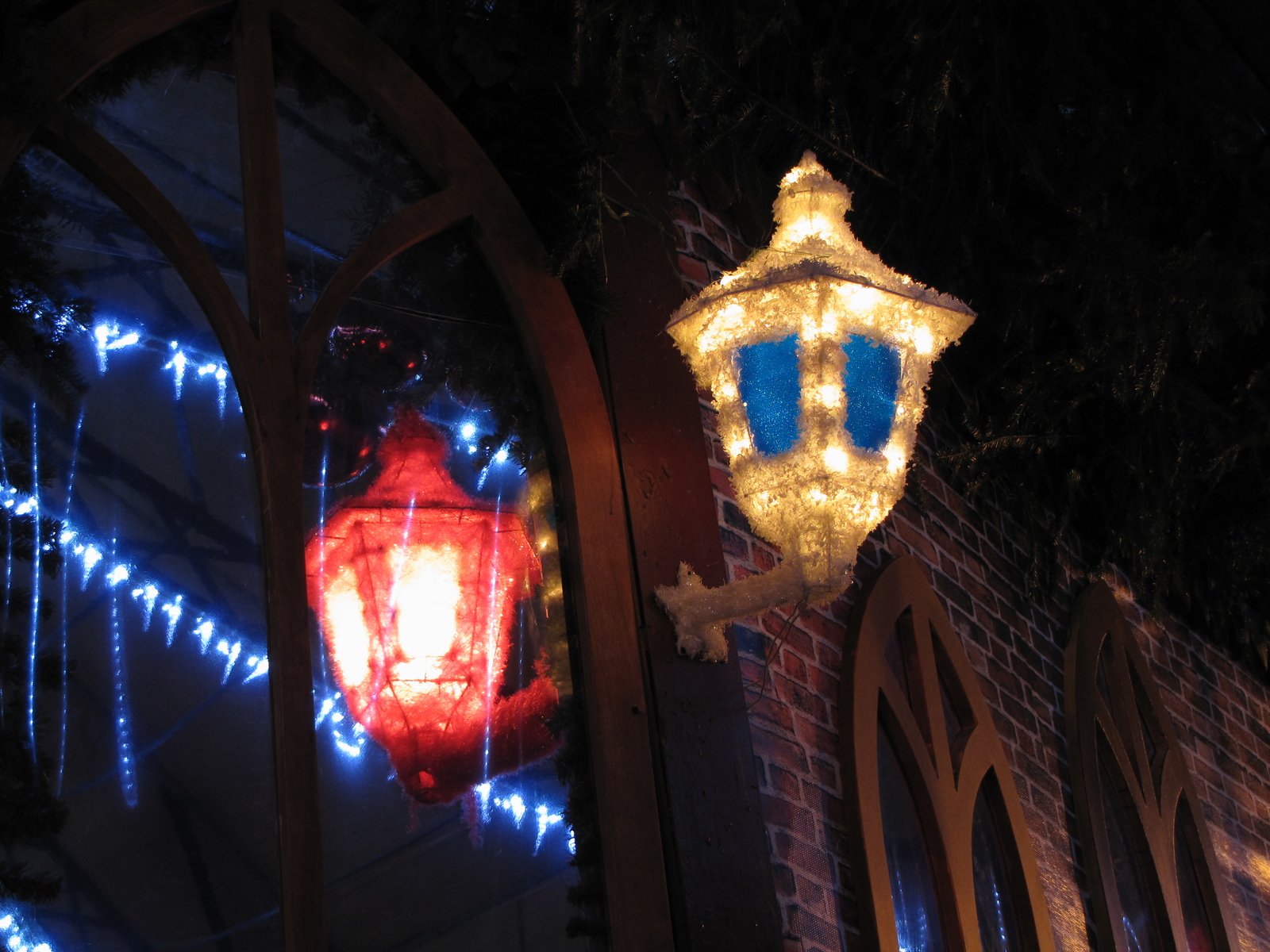 light hanging from the side of a building at night