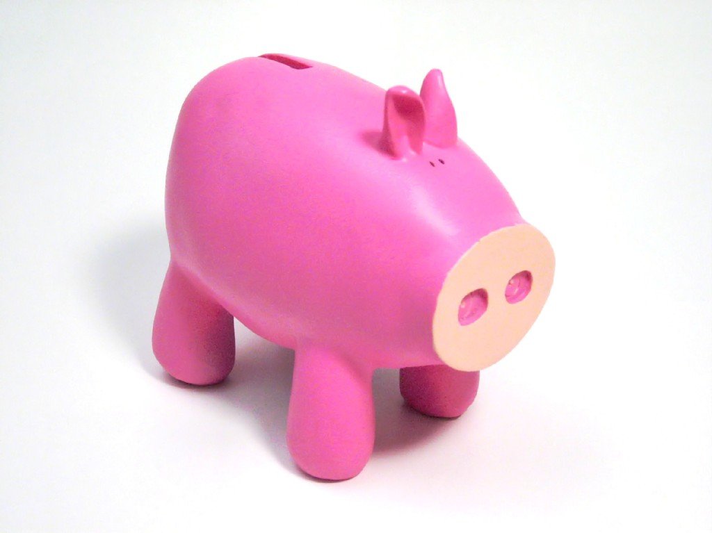 a pink ceramic pig on a white background
