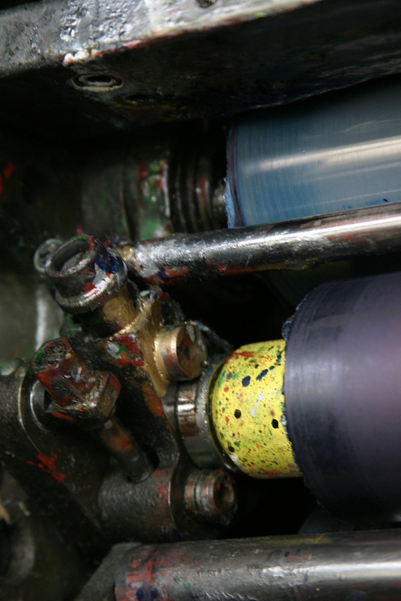 a close up of various colorful paint splattered pipes