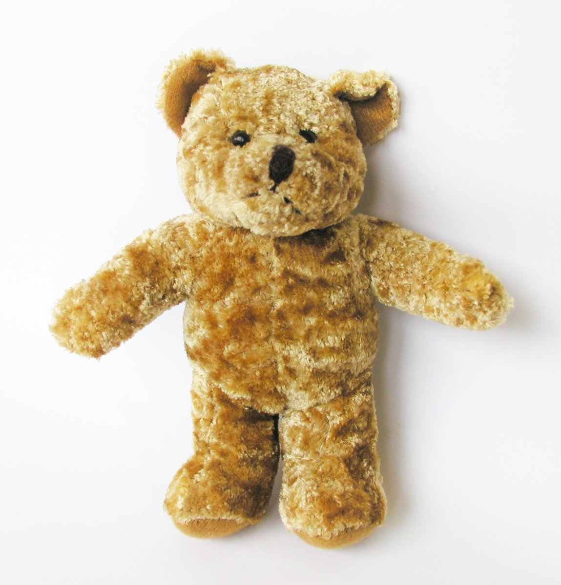 a teddy bear that has just fallen apart from it's body