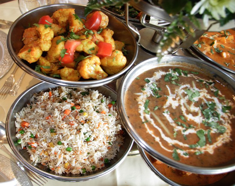 a variety of dishes sit on a table