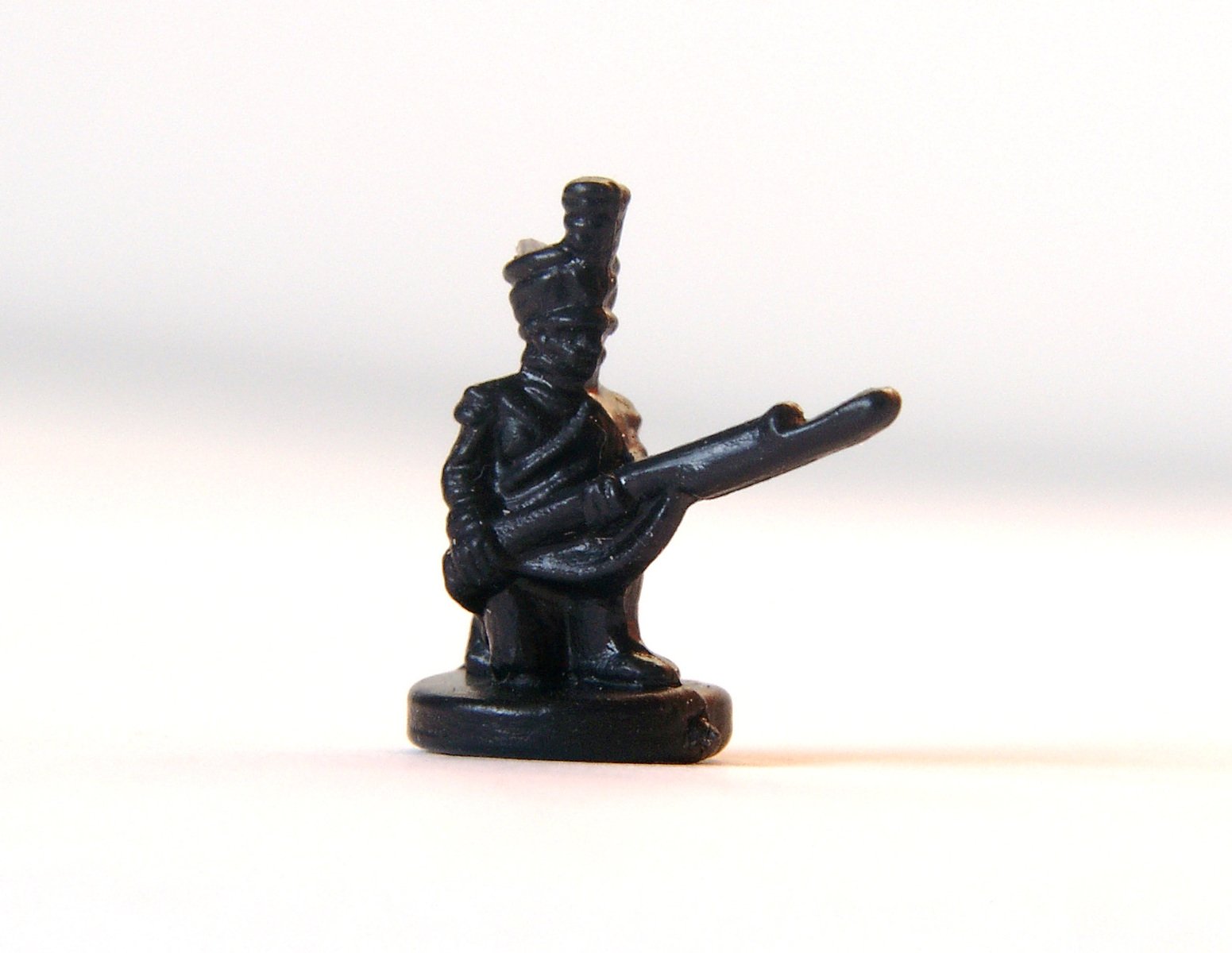 a toy figurine of a man with a pipe