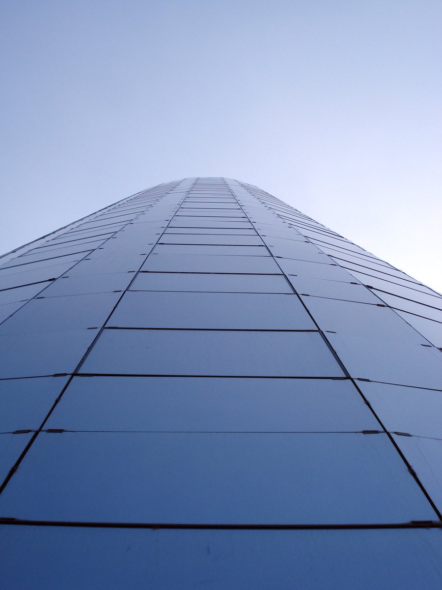 the view of a building from below on a sunny day