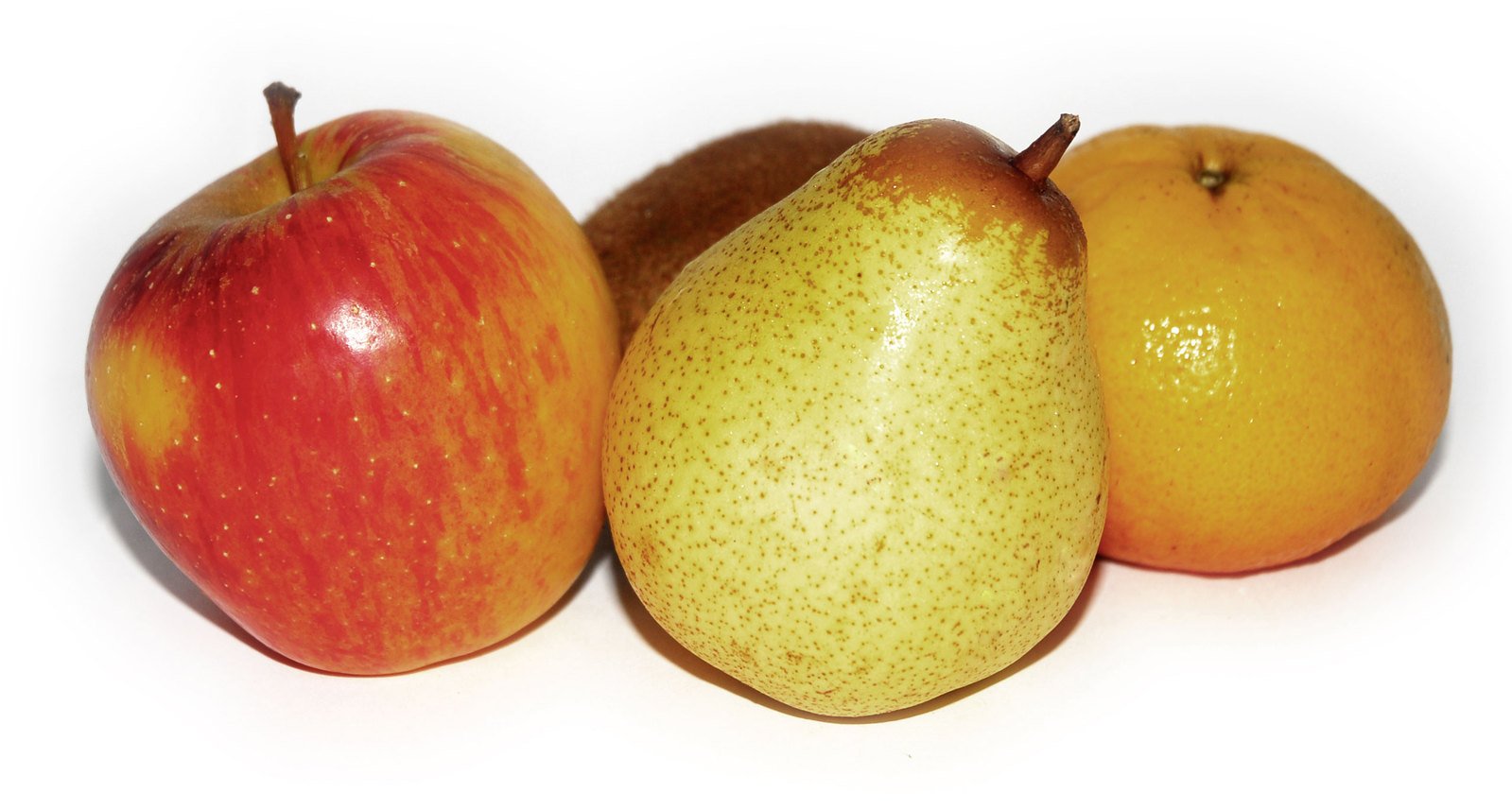 a group of three fruits sitting next to each other