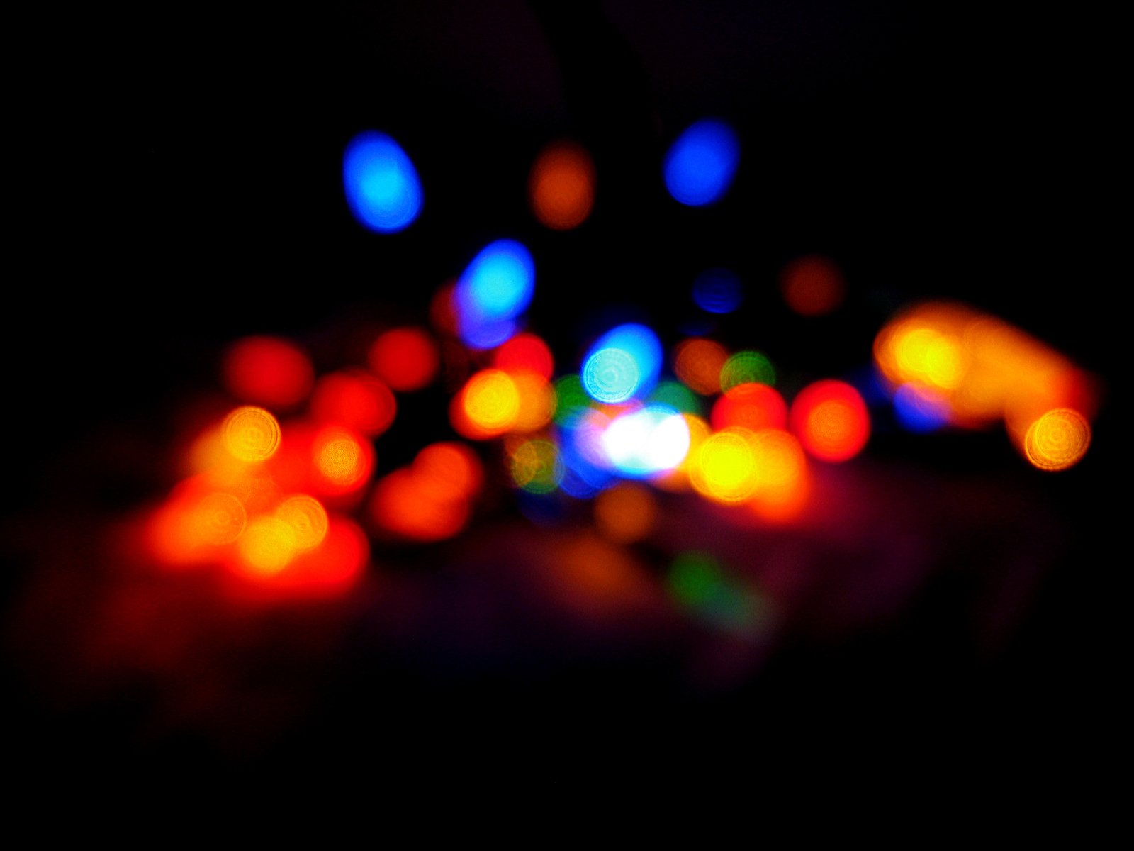 some brightly colored light lights on a black background