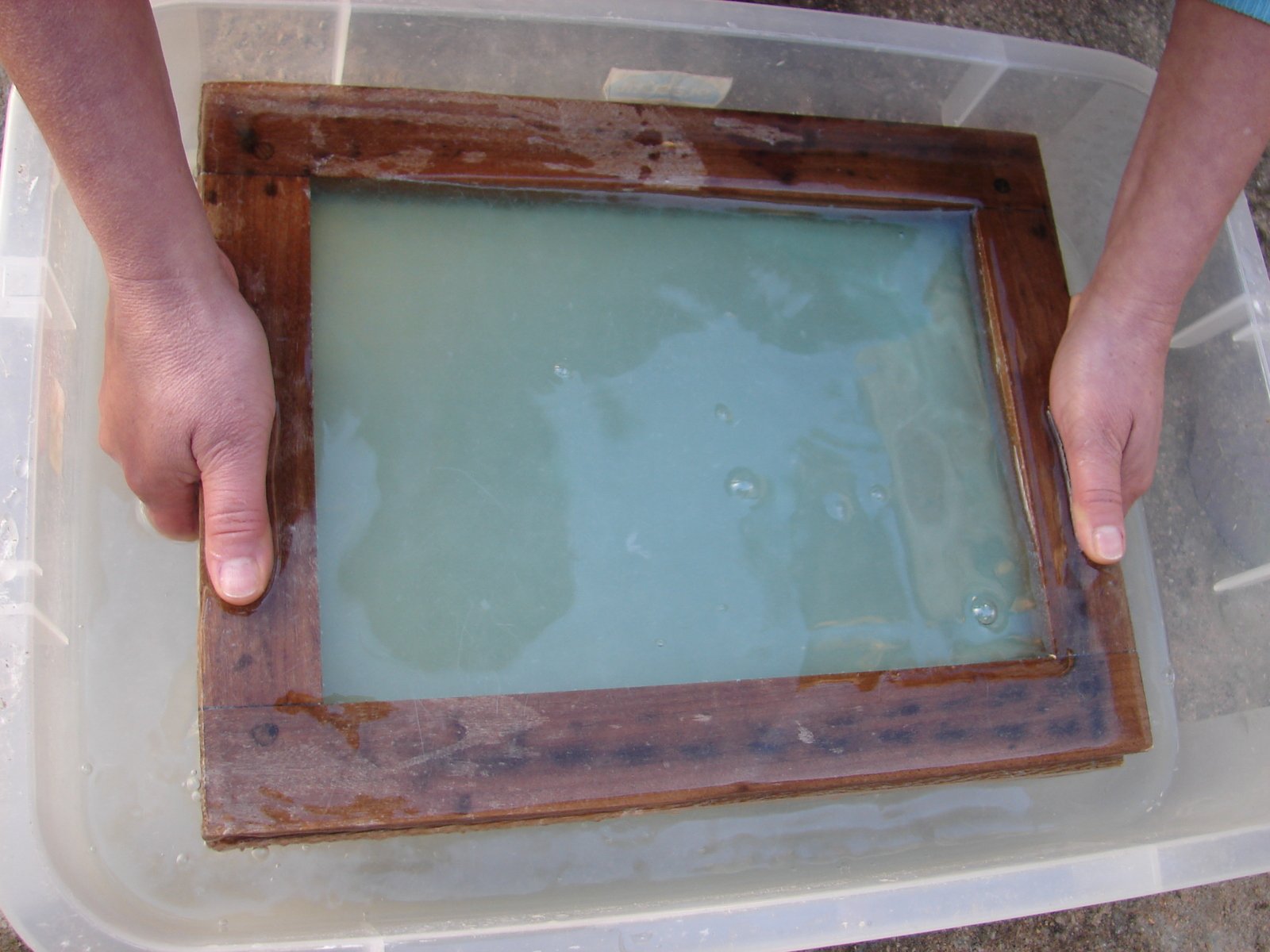 a person that is holding an empty square