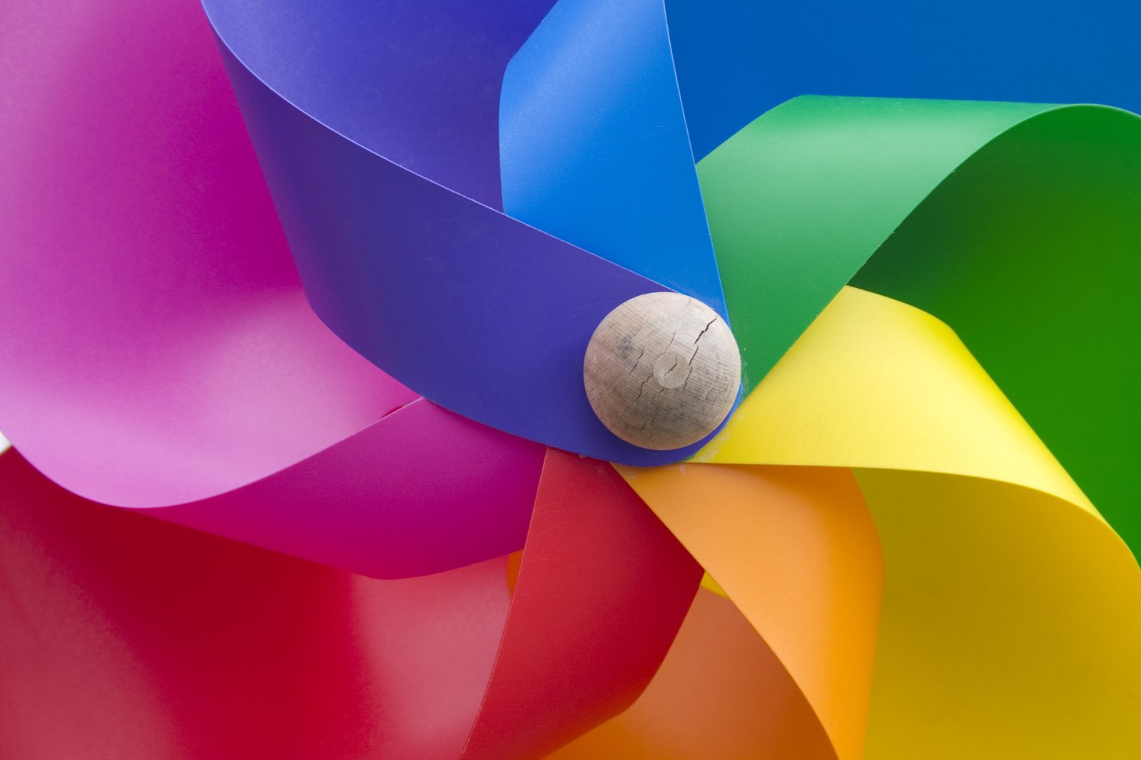 a single colorful object on the top of a large umbrella