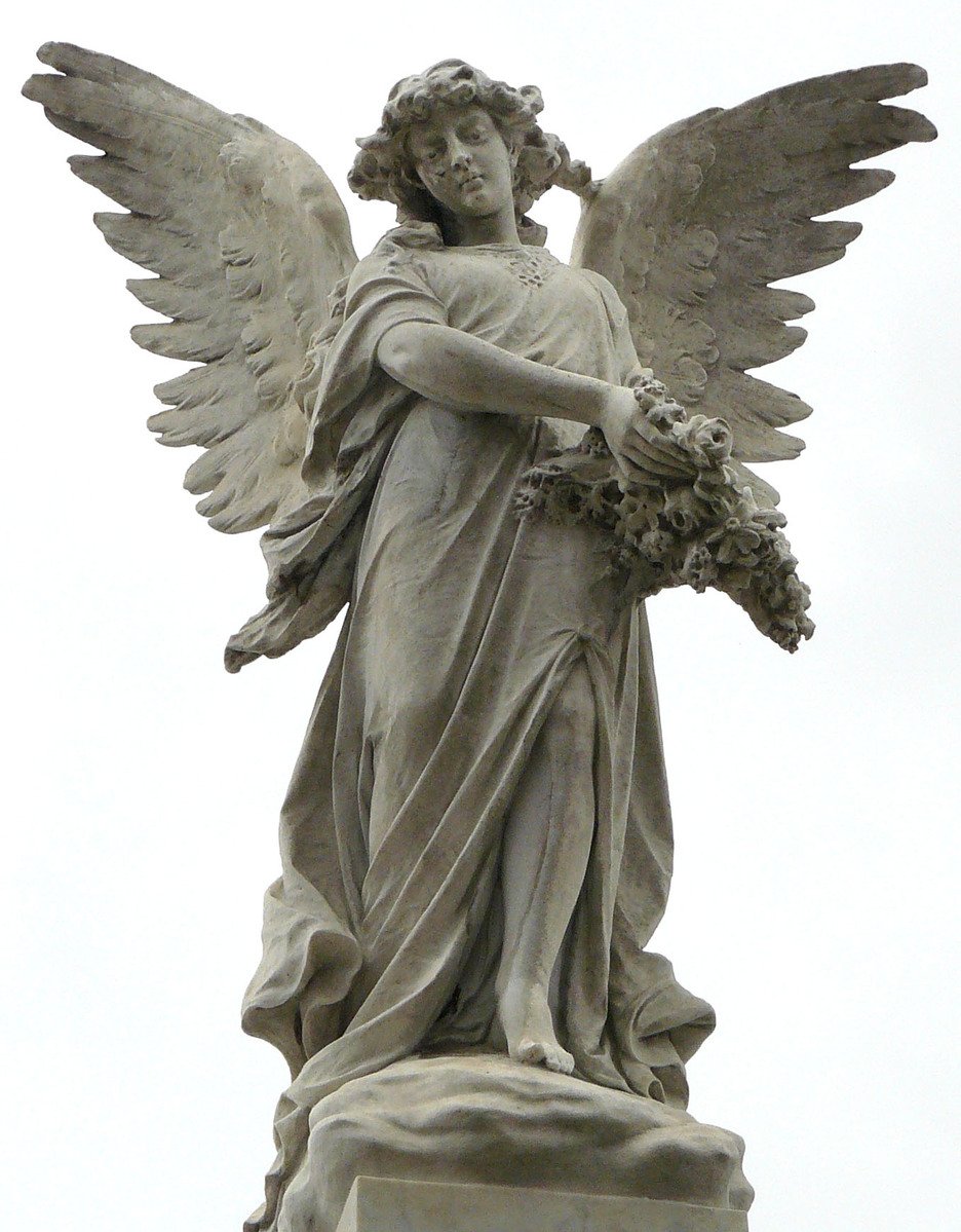 a statue of an angel holding a bouquet