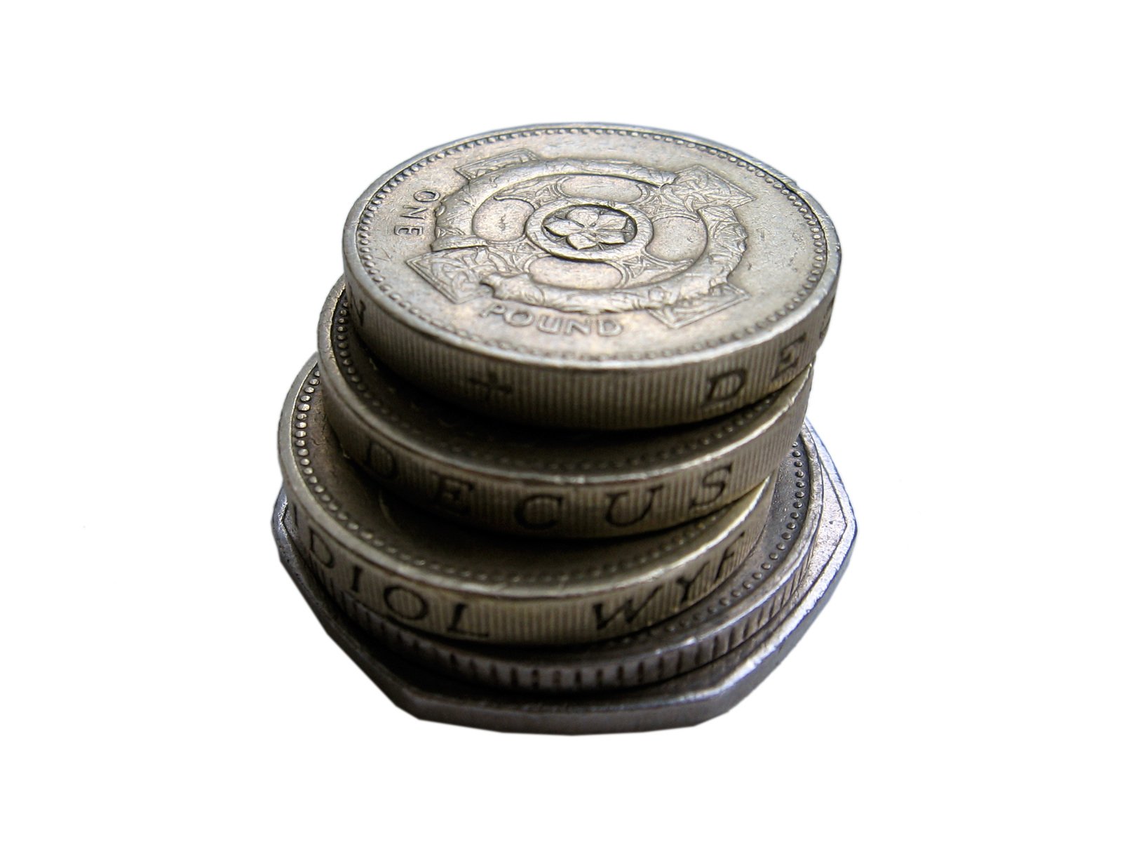 four stacks of pound coins stacked on top of each other