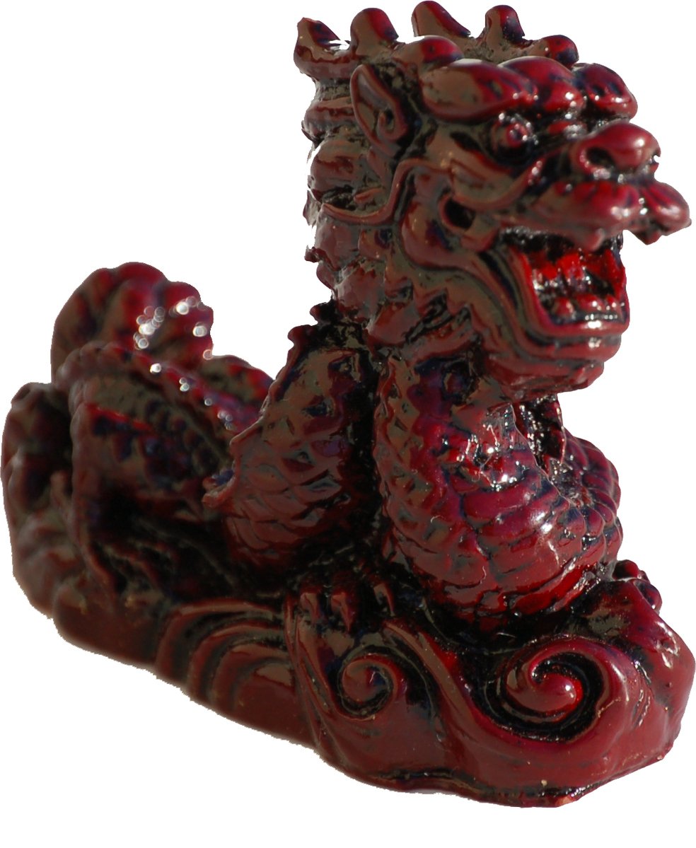 a ceramic gargoyle figure is shown in red and black