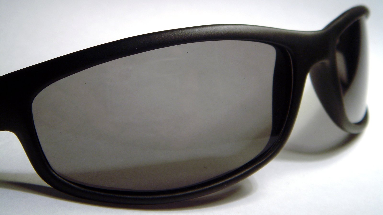black sunglasses sit in a close up position