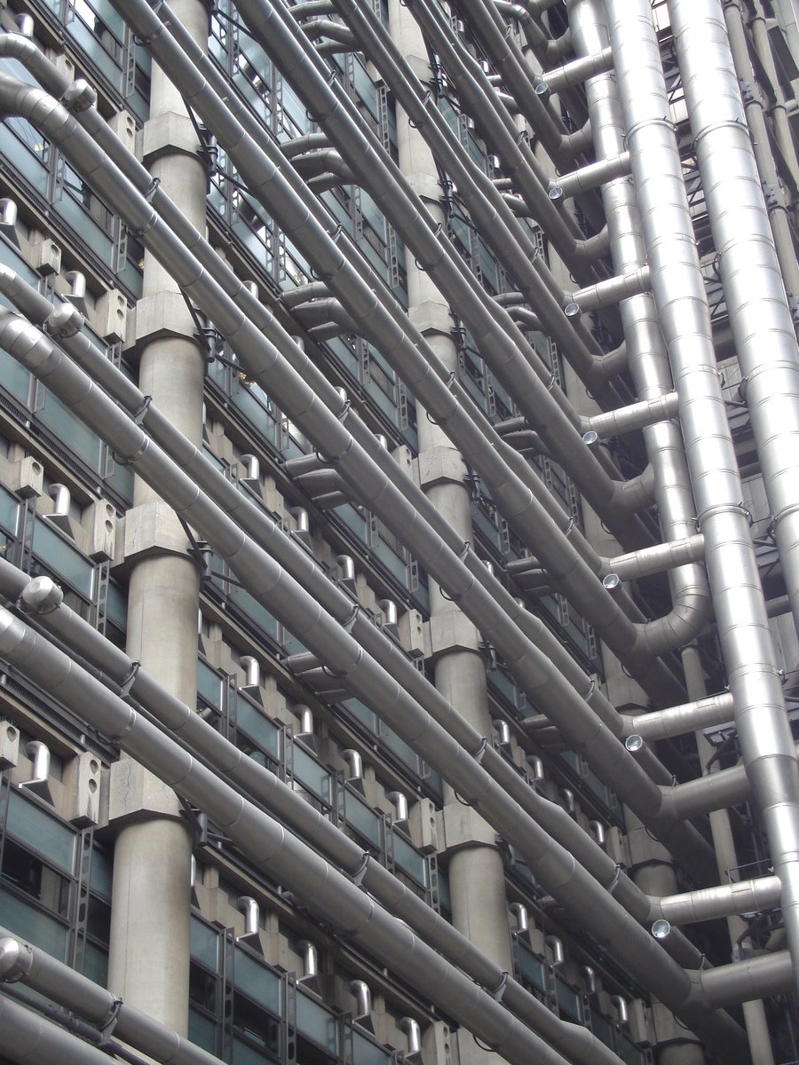 multiple metal pipes stacked up on top of each other