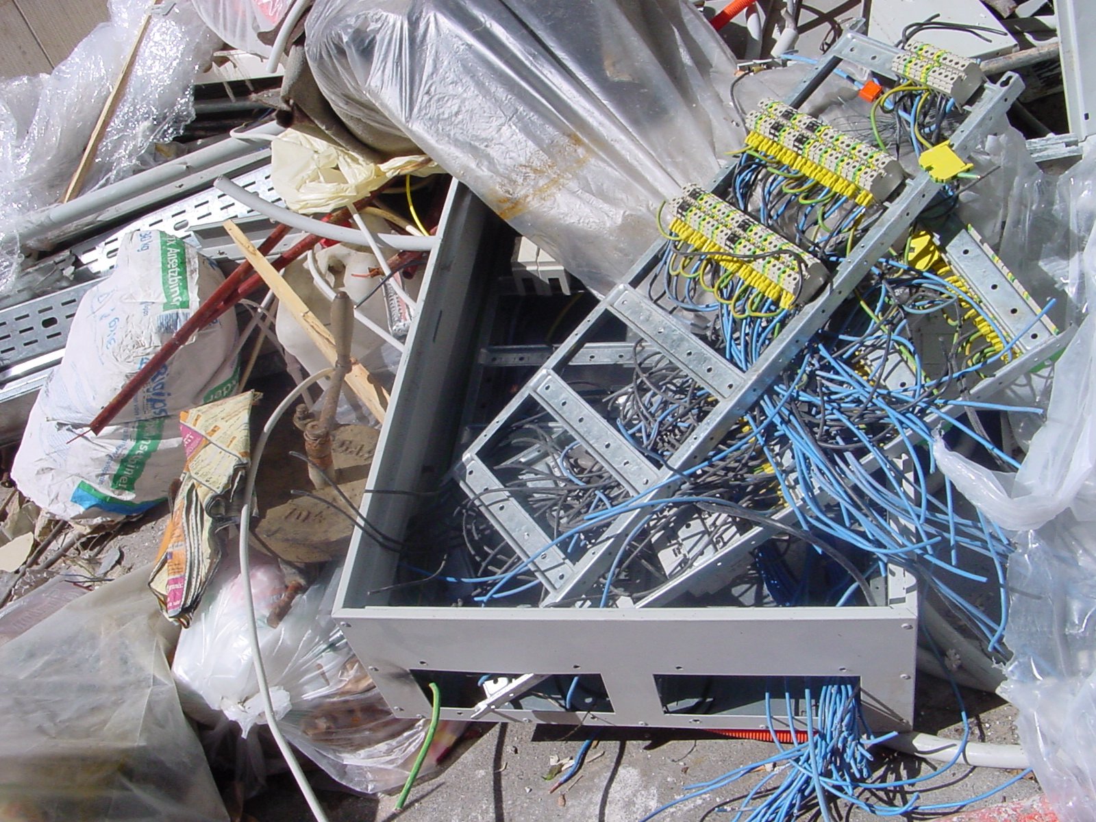 an empty computer case surrounded by lots of wires