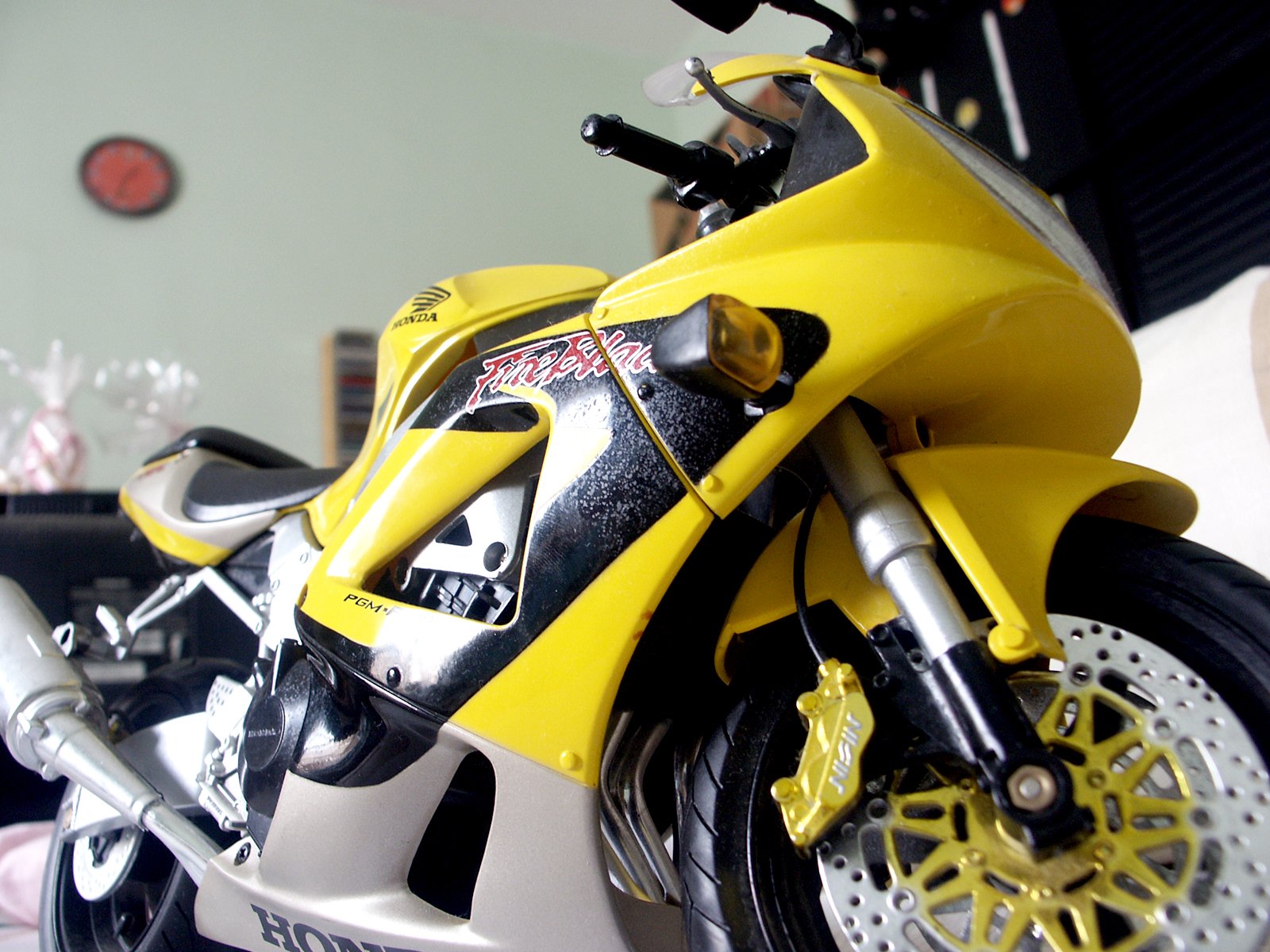 the front wheel of a motorcycle parked inside of a building