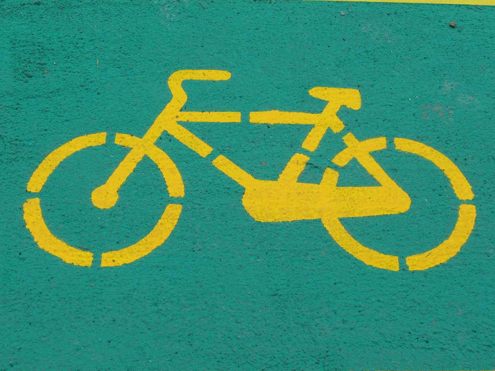 an image of a bike painted on the sidewalk