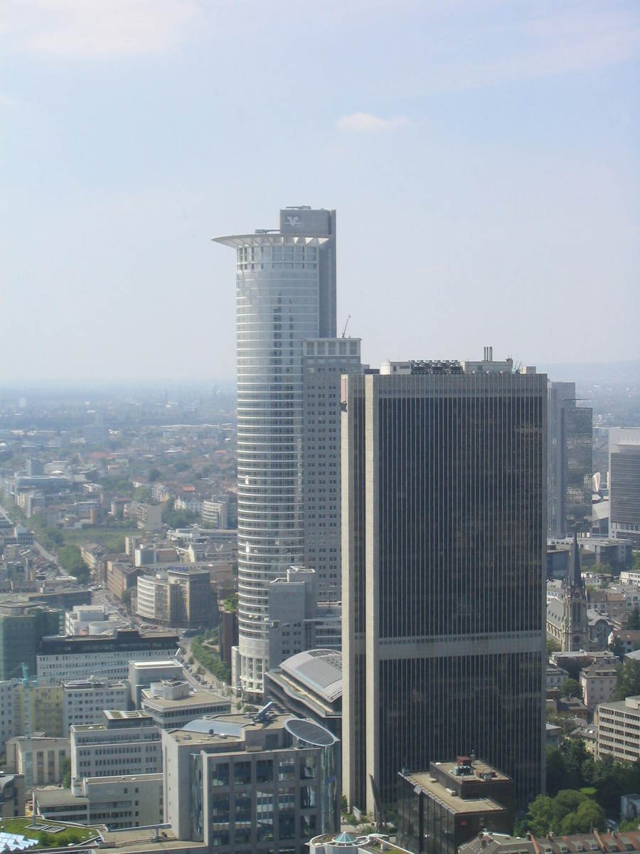 aerial view of city, with tall buildings and waterway