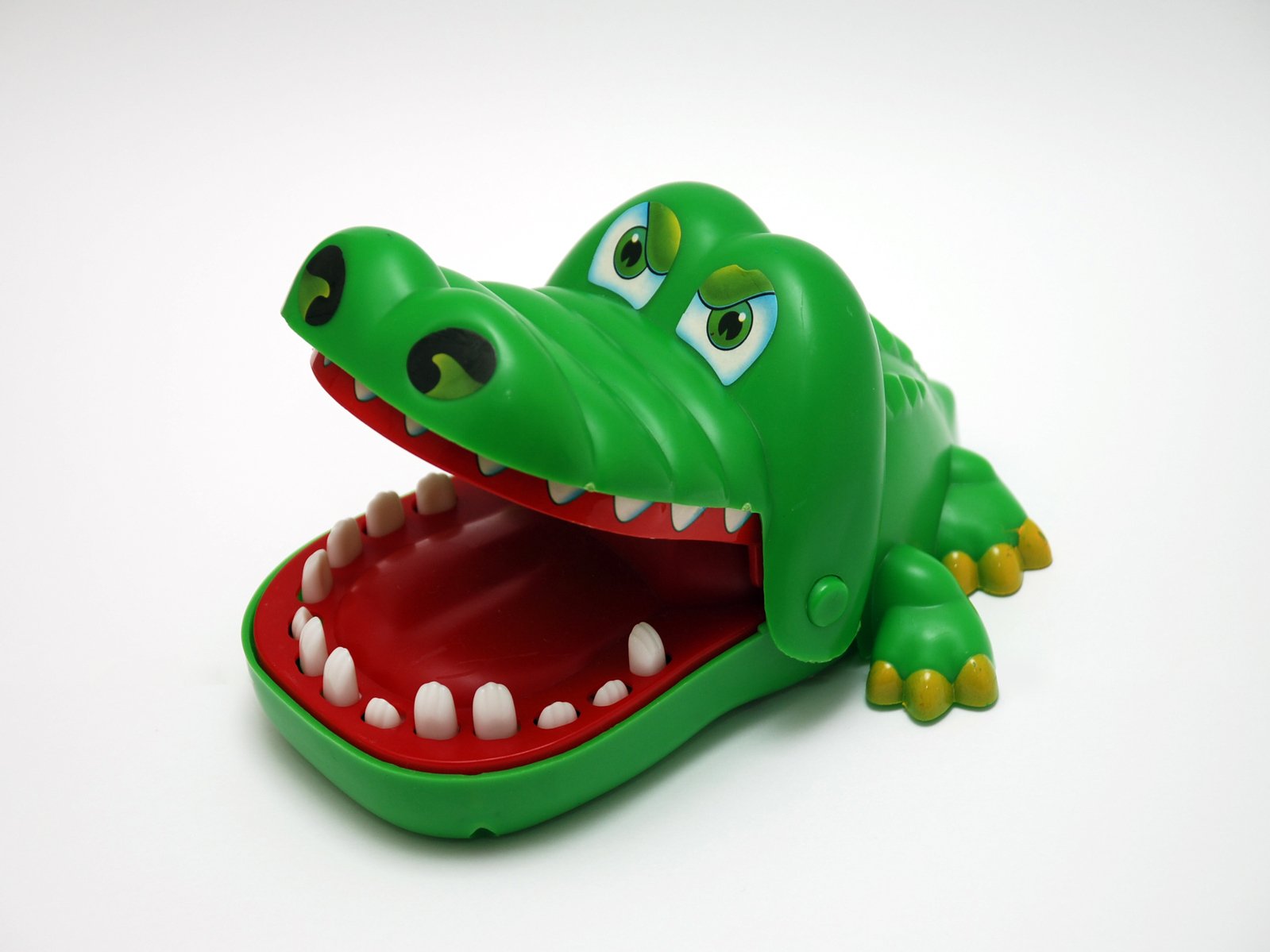 a toy crocodile's teeth and green eyes
