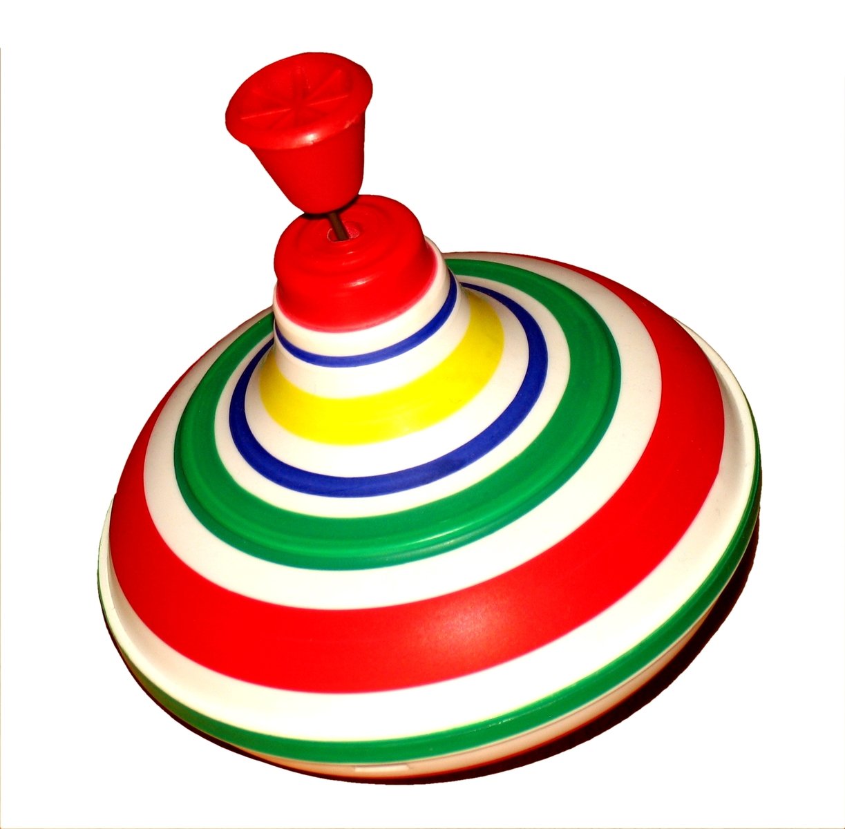 a colorful red on on top of a striped toy