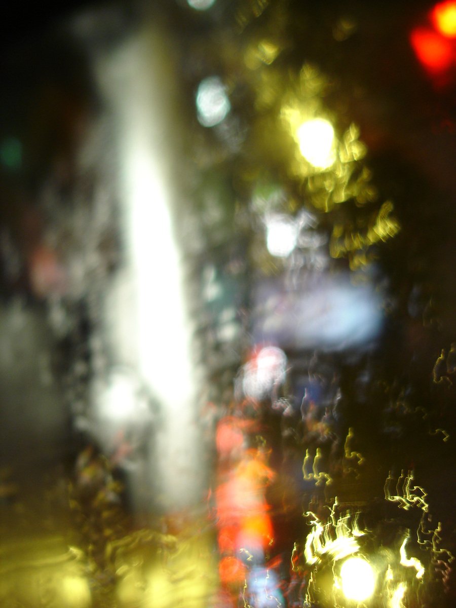 a street light with blurred lights is shown