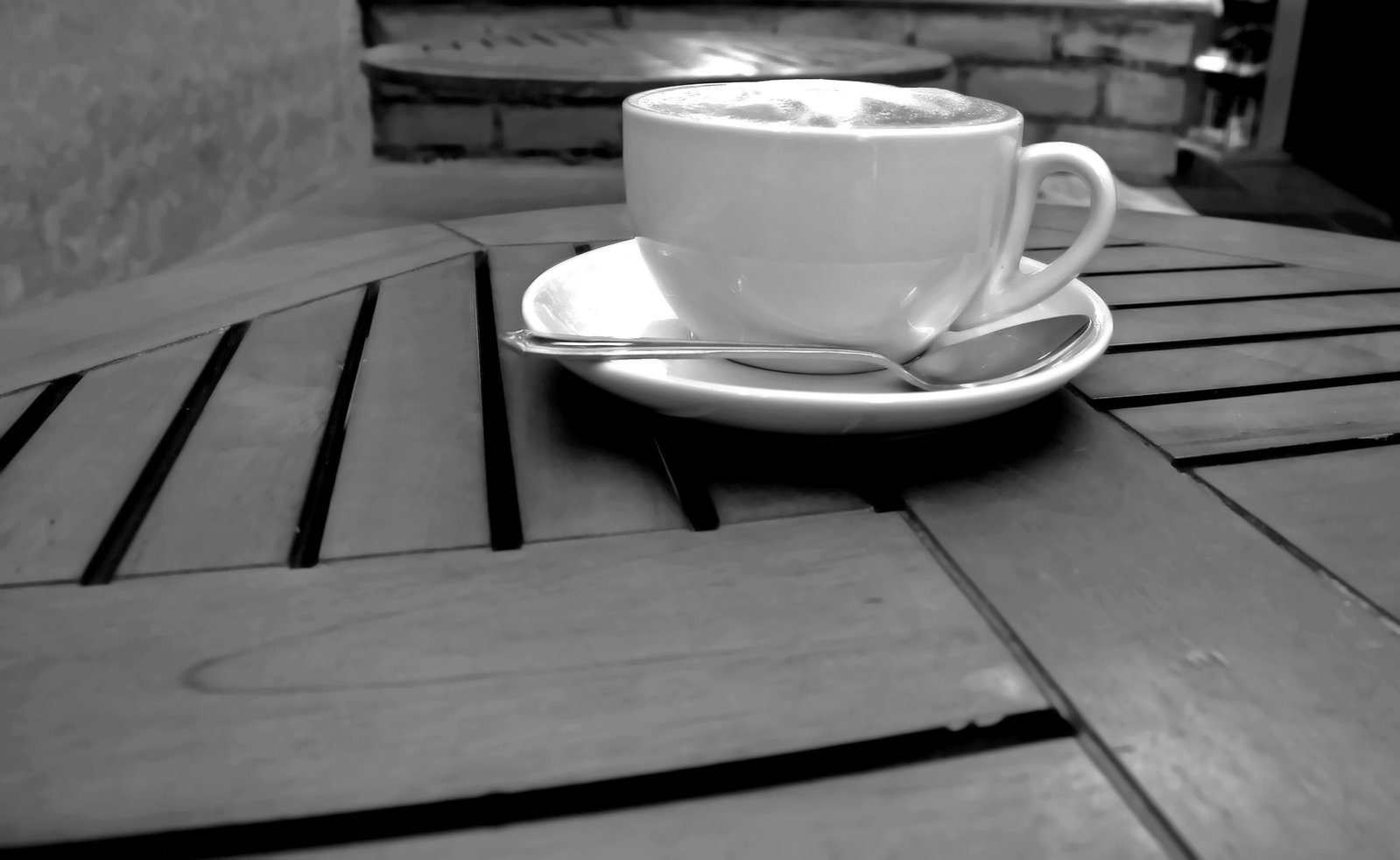 a coffee cup with some liquid on top