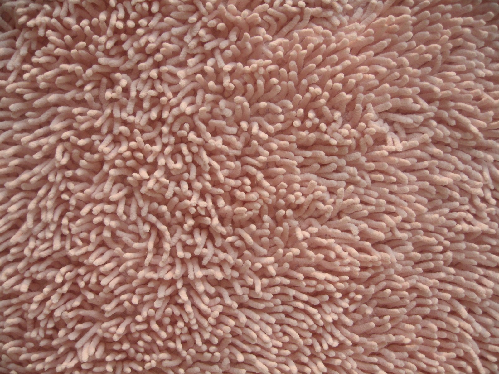 coral textured, with tiny bubbles of white coral