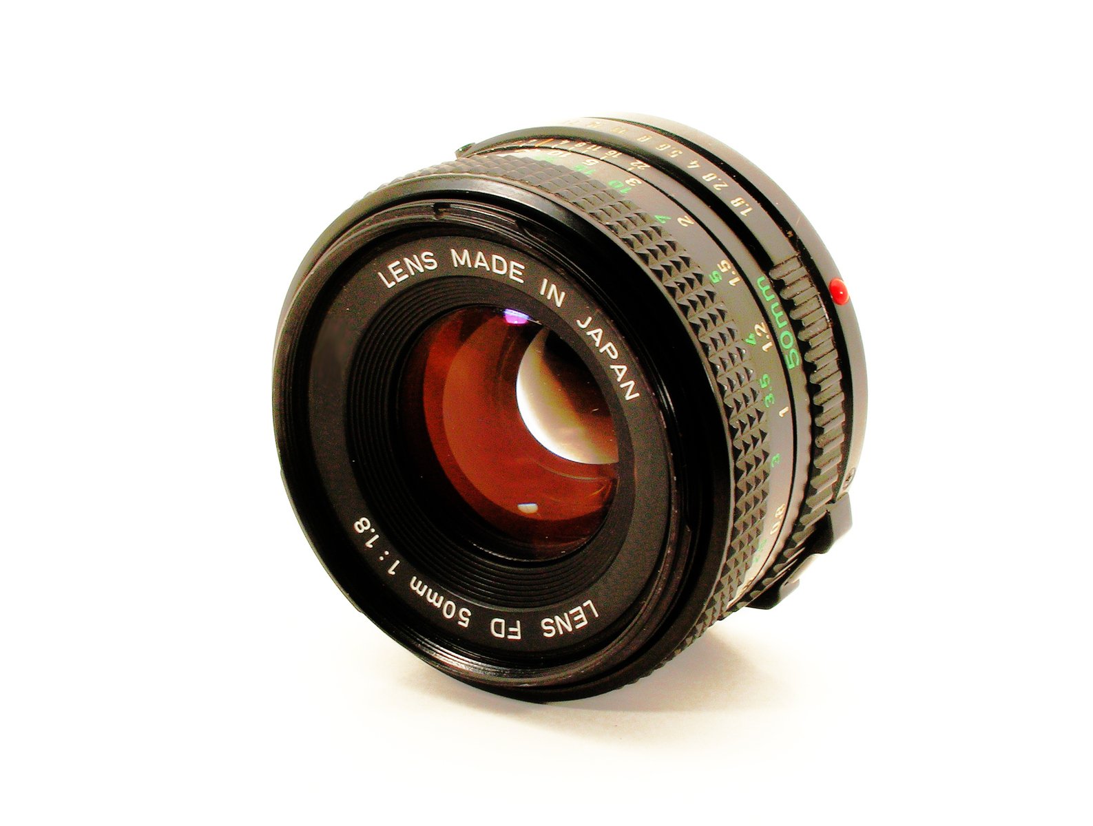 a black and white lens on white surface