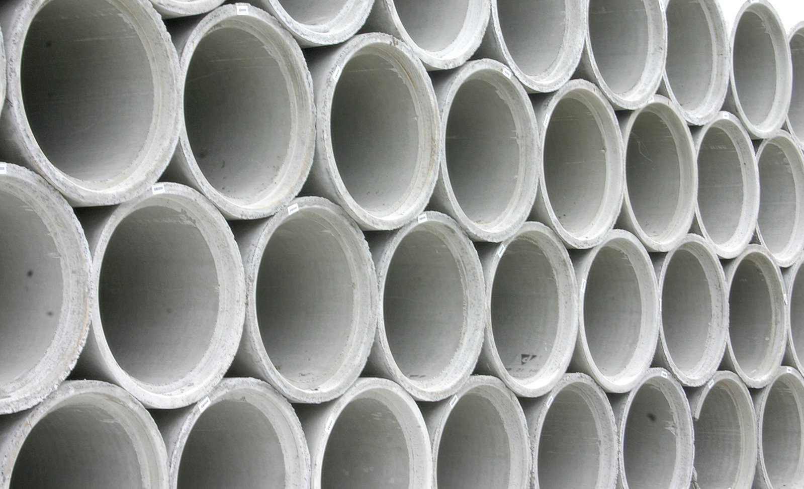 a large stack of pipe for transportation
