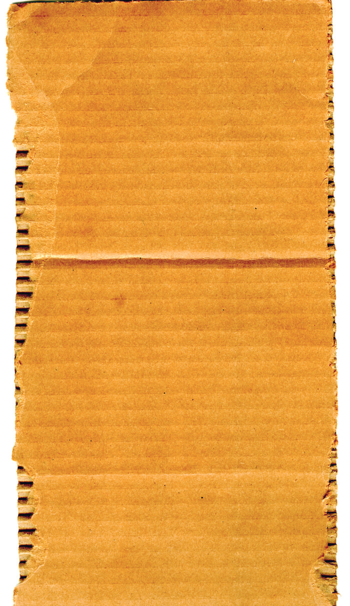 a piece of old - fashioned, burnt paper sitting on a white surface