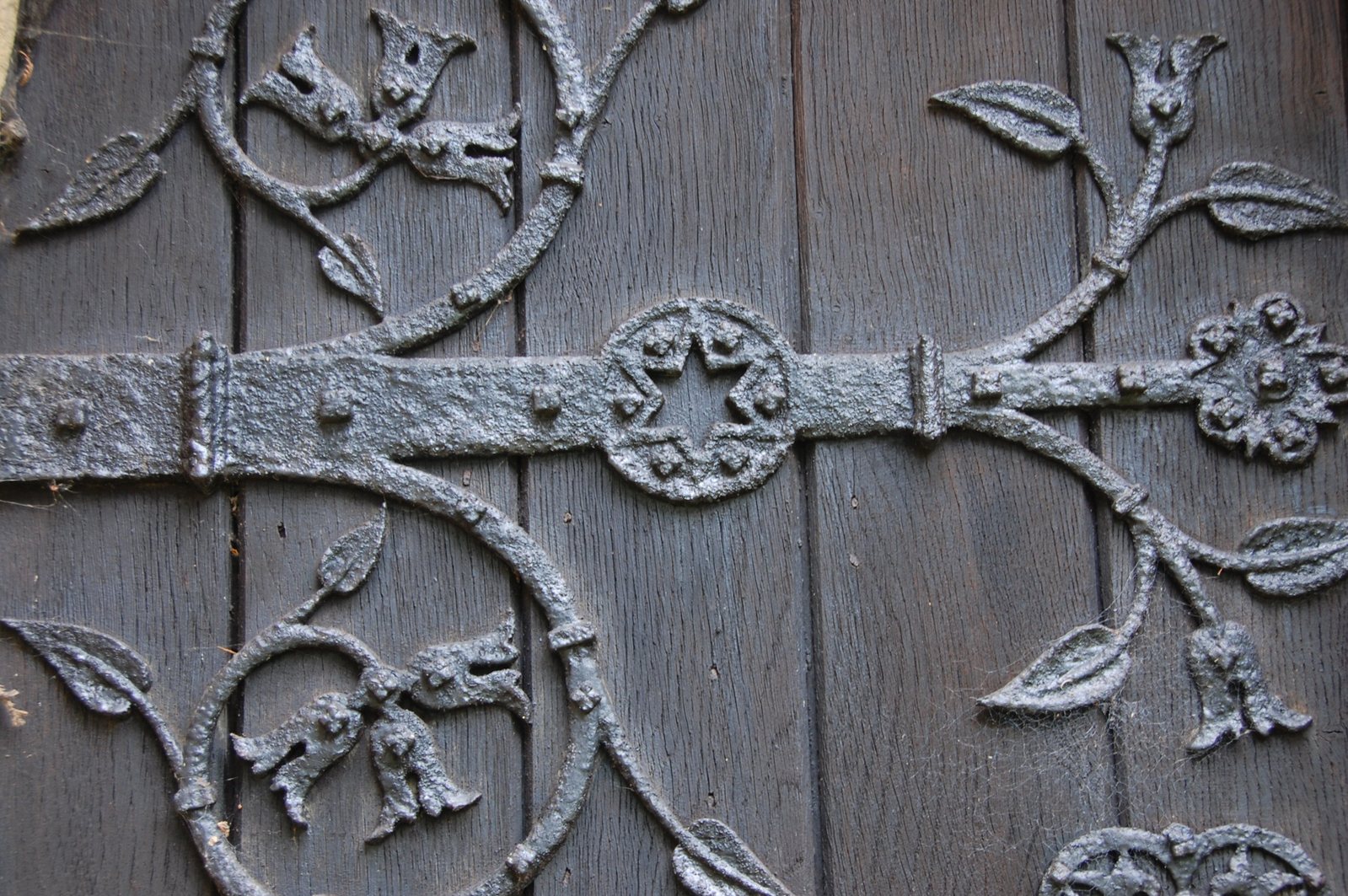 an elaborate wooden carving on the wall