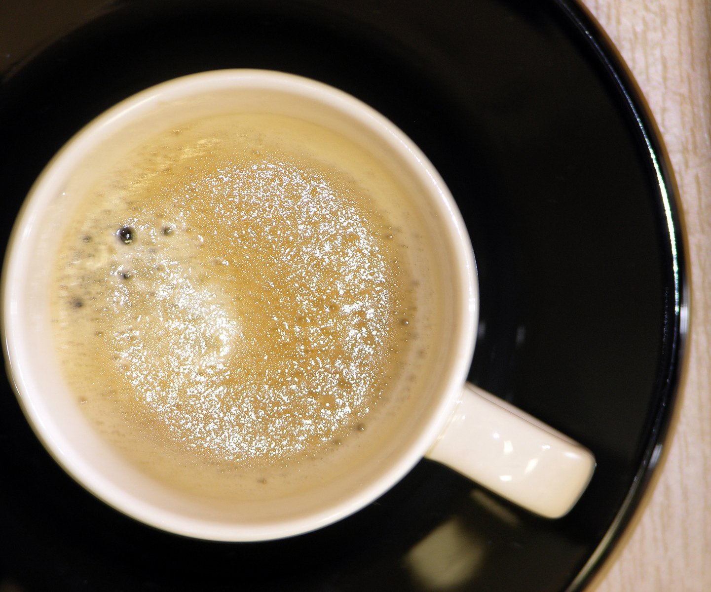 coffee in a mug is set on top of a plate