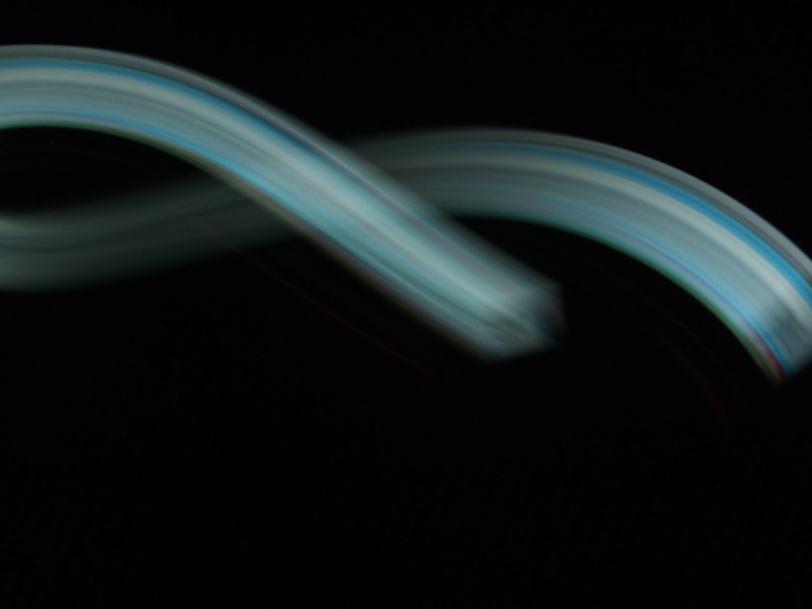 a light painting with multiple strips in the dark