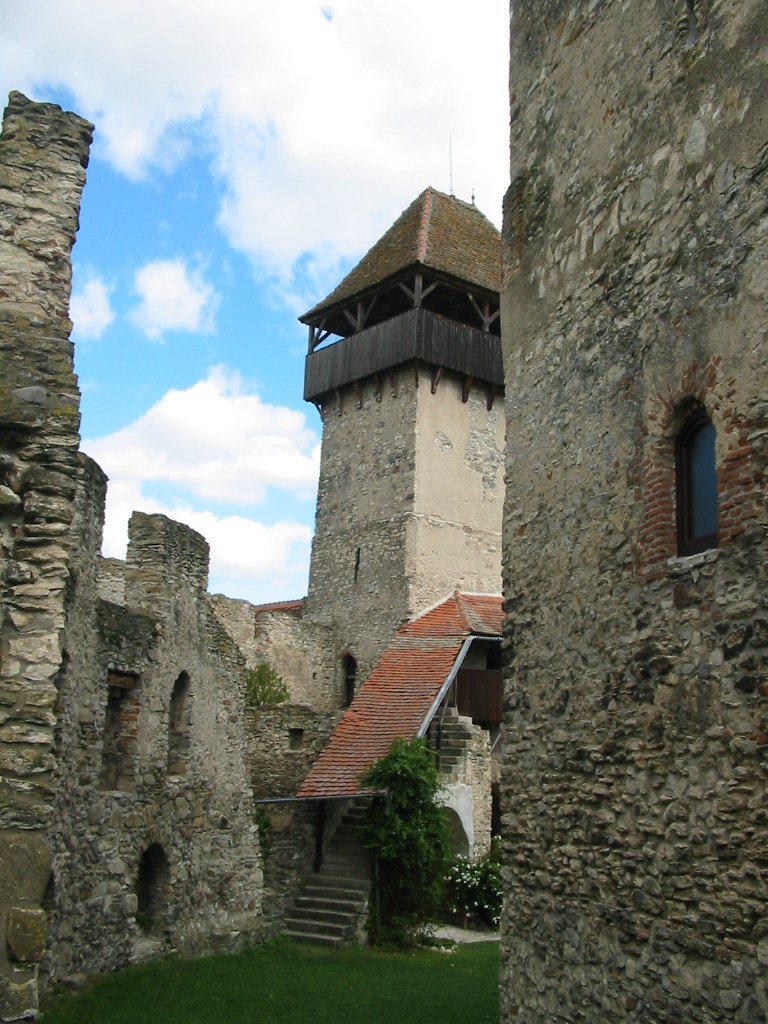 a tall tower sitting on the side of a building