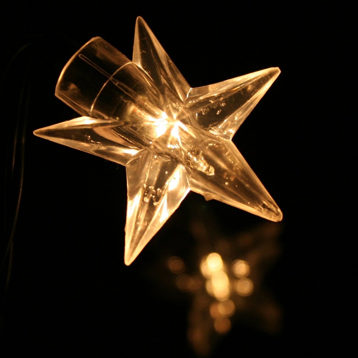 lights with a star shape on top in the dark