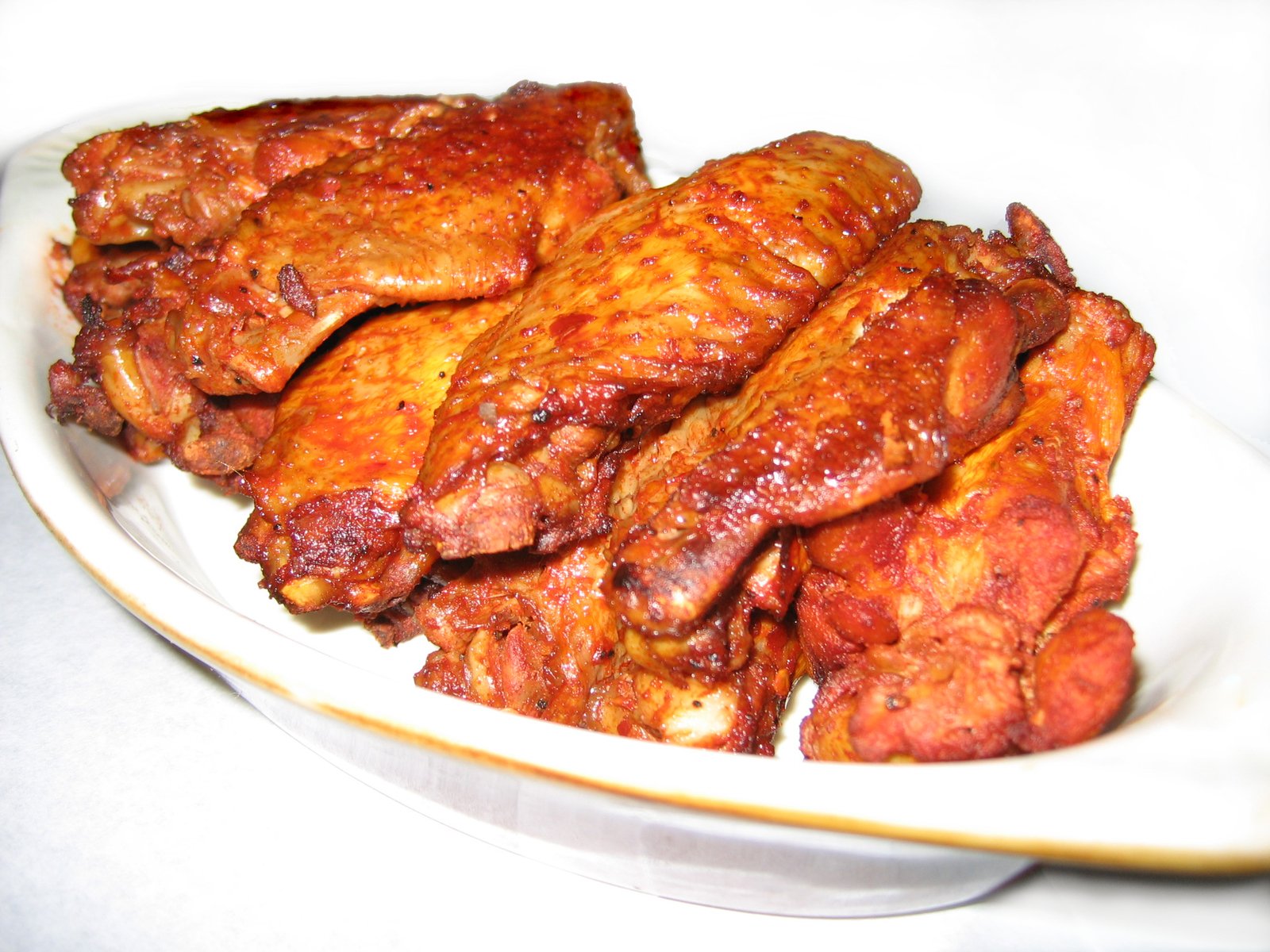 pieces of cooked meat in a white bowl