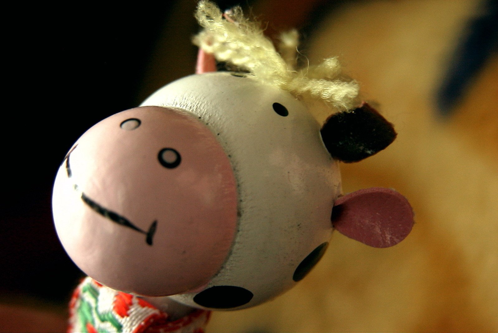 a toy animal made from a cow and doll hair